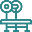 A simple, teal line drawing of a vintage film camera with two reels on top, mounted on a tripod.